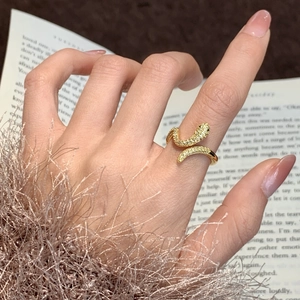 Adjustable gold-plated snake ring featuring sparkling micro-pave cubic zirconia stones