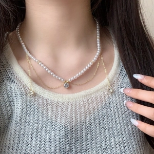 Double-layer pearl and gold chain necklace with sparkling zircon pendants for women