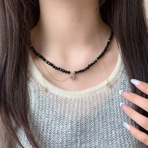 Elegant multi-layer black crystal beaded necklace with gold chain and zircon tassels