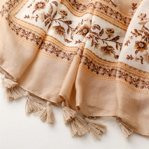 Detail of vintage floral cotton linen scarf showing soft texture and elegant fringe