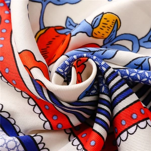 Macro shot of ethnic style silk shawl showing twill weave fabric texture and floral pattern