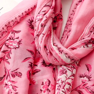 Detail showing high-quality pink floral linen-touch scarf fabric with elegant patterns