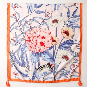 Detailed square silk scarf with floral squirrel print and orange decorative tassels