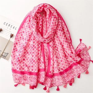 Pink cotton-linen feel scarf with star pattern and soft tassel edges on white background