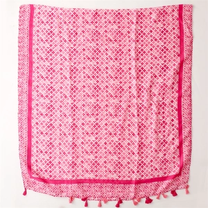Detail of pink cotton-linen feel scarf with cross star pattern and tassel fringe edges