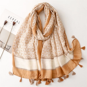 Elegant floral print cotton scarf with decorative tassels and a soft Bohemian style