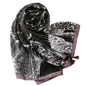 Ethnic style beach shawl with black abstract prints, purple border and tassel details