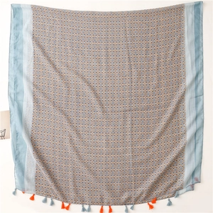 Retro geometric print chiffon shawl with blue borders and decorative orange tassels