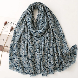 Navy blue cotton linen feel scarf with white leaf patterns and fringe edges