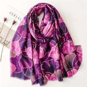Detail of purple cotton linen scarf with gold foil ginkgo leaf pattern and fringe trim
