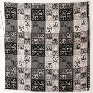 Retro plaid cashmere-feel scarf with monogram pattern and fringe in grey and black