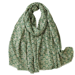 Dark green cotton-linen scarf featuring white leaf prints and fringe edges for women