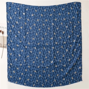 Close-up of vintage navy blue paisley cotton linen scarf with soft fringe edges