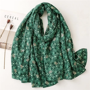 Dark green vintage paisley scarf with golden patterns and soft cotton-linen texture