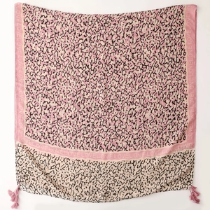Detailed view of pink leopard print scarf with LOVE letters and decorative corner tassels
