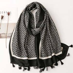 Black and white geometric ring print scarf with fringe details and soft texture