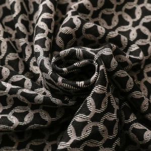 Close-up of interlocking ring jacquard pattern on thick herringbone winter scarf