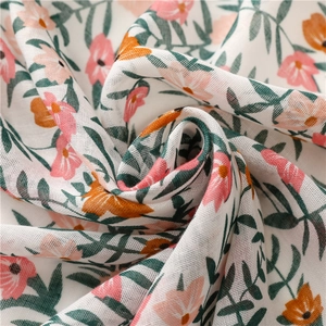 Detail of floral printed cotton linen scarf showing soft fabric texture and fringe tassel
