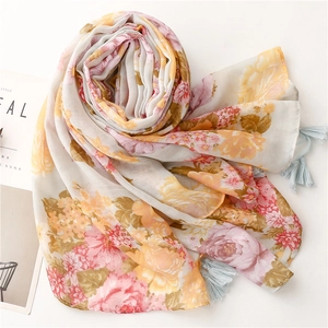 Vintage floral cotton scarf with pink blossoms and light blue tassels on a white base