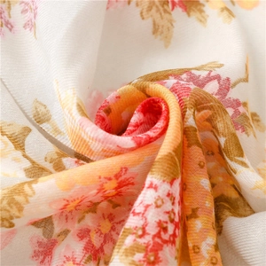 Macro shot of soft cotton-linen fabric with vintage floral print and sheer texture