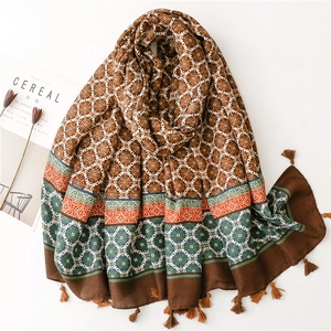 Thick warm winter scarf with geometric floral print and brown tassels for women