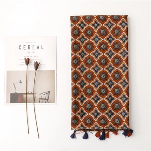 Floral cotton linen scarf with tassels and star patterns on minimalist background