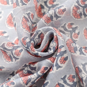 Close-up of floral print cotton linen scarf with soft drapes and blue floral textures