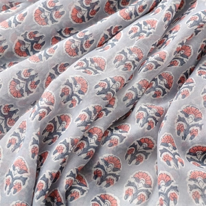 Detail of floral print linen scarf with blue botanical patterns and breathable texture