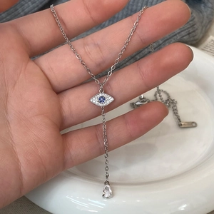 Silver Evil Eye necklace with zircon pavé, blue center stone and teardrop crystal pendant