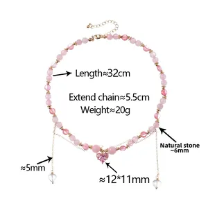 Detail of pink natural stone beaded necklace featuring a faceted heart-shaped pendant