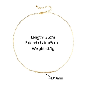Detail view of gold necklace with 40x3mm micro-pave zircon curved pendant bar