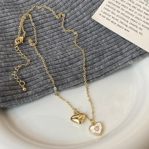 Golden double heart pendant necklace with shell inlay and zircon on a minimalist chain