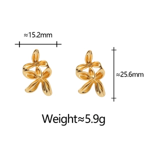 Detail view of gold ribbon earrings with dimensions 15.2mm width and 25.6mm height