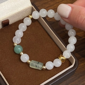 White crystal and jade beaded bracelet with green prehnite accents and gold beads