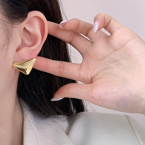 Polished gold geometric triangle earrings for women with a minimalist high-shine finish
