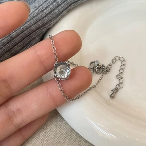 Elegant silver chain bracelet featuring a single large round-cut zircon on a minimalist band