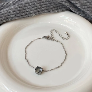 Elegant stainless steel chain bracelet featuring a large round zircon and lobster clasp
