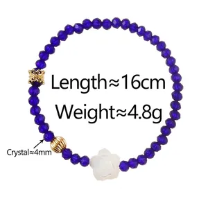 Bracelet en perles de cristal bleu avec breloques papillon dorées et pendentif rose blanche