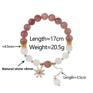 Detail view of strawberry quartz bracelet with 8mm natural stones and sunflower charm