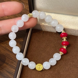 Elegant natural white agate bead bracelet with red accents and gold coin charm detail