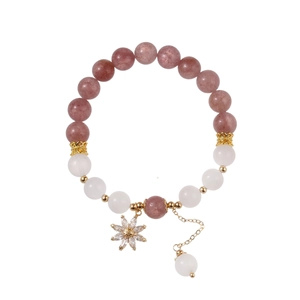 Beaded bracelet with strawberry quartz white crystals and a sparkling zircon star pendant