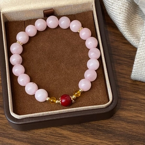 Natural rose quartz and strawberry quartz beaded bracelet with gold accents in gift box
