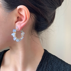 Bohemian handmade hoop earrings with light blue natural stones and gold wire wrap
