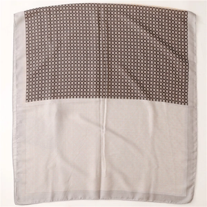 Detail of clover print cotton linen scarf showing two-tone geometric patterns and stitching