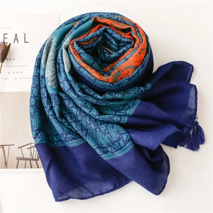 Bohemian paisley sun protection shawl with blue and orange patterns and tassels