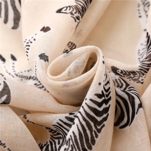 Macro detail of breathable beige linen fabric with stylish black and white zebra print