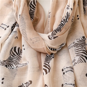 Detailed close-up of zebra print scarf with light linen-feel fabric and soft texture