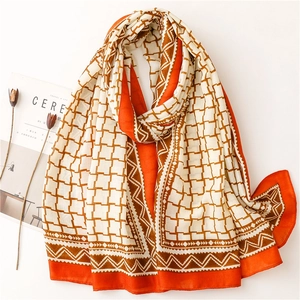 Fashionable orange and brown geometric plaid scarf with chic fringe and soft texture