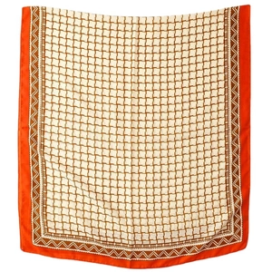 Elegant geometric silk shawl with orange and brown grid pattern on white background