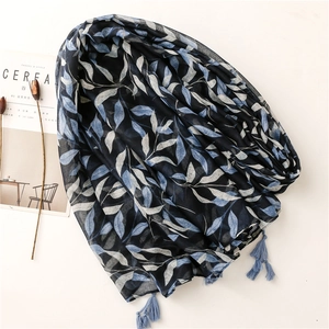 Elegant navy blue scarf with light blue leaf print and matching corner tassels